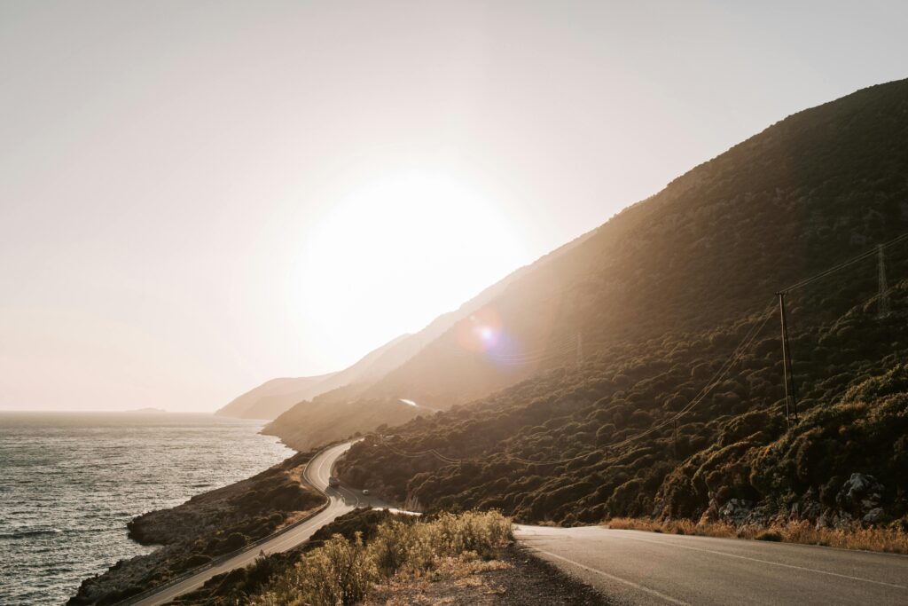 Elevate your landscape photography by utilizing roads or pathways as leading lines to lead the viewer's eye towards breathtaking mountains or sunsets